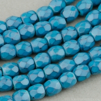 Round Faceted (3mm) Turquoise Opaque with Jet Honeycomb Finish